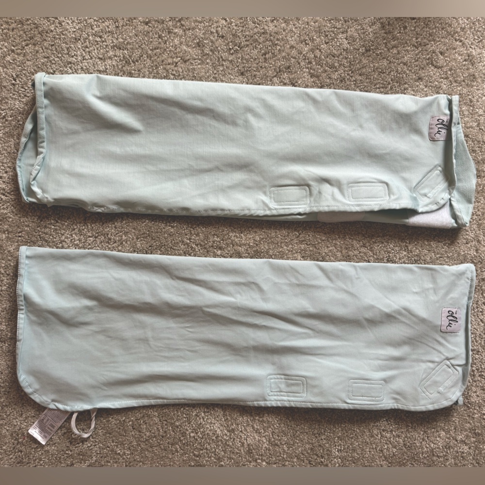 Two light blue Ollie swaddles